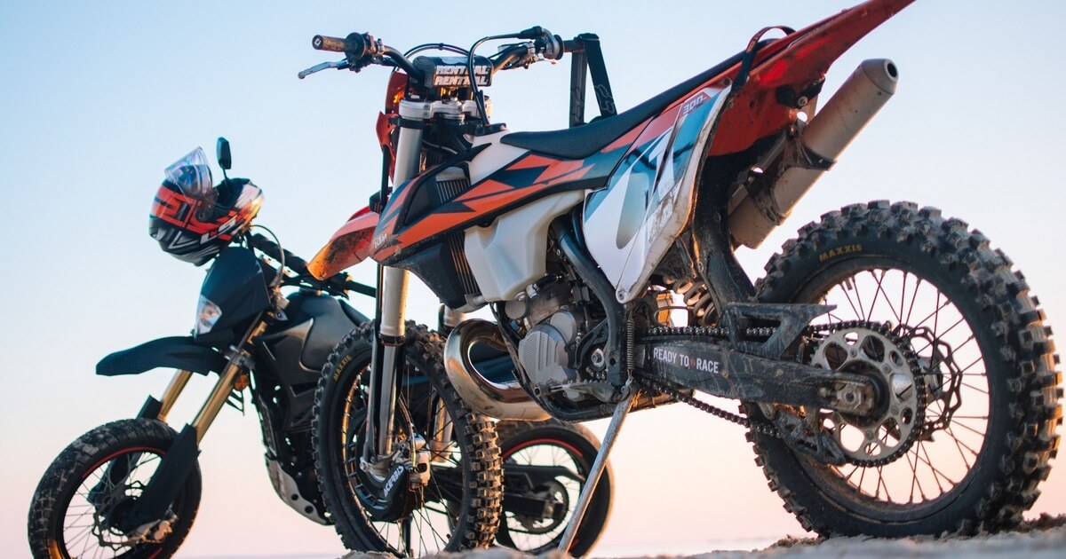 Two parked dirt bikes