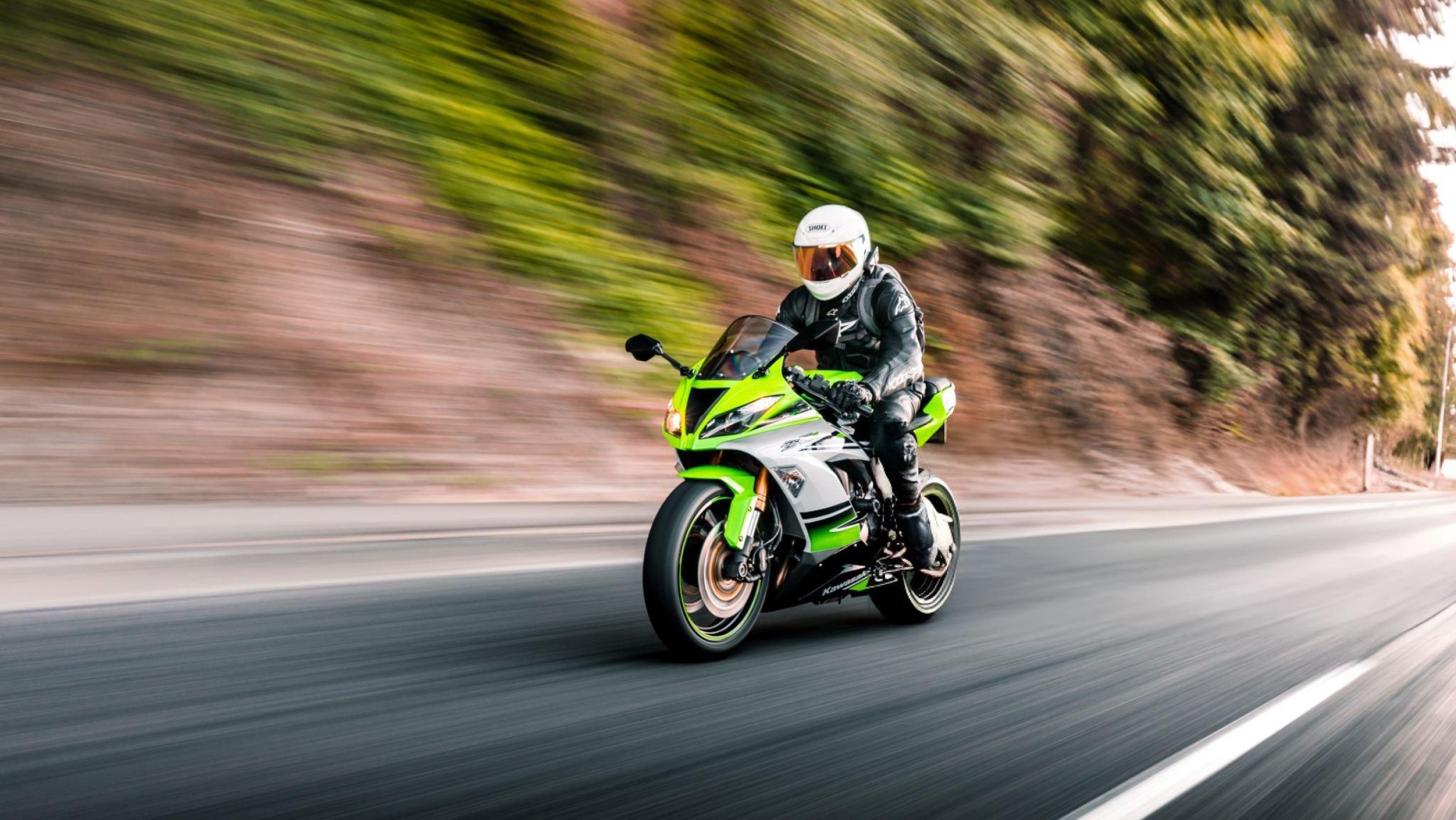 250cc sports motorcycle on an open road at sunset
