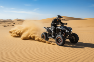 Sport quad bike speeding through the desert, kicking up sand, designed for high performance and thrilling rides.